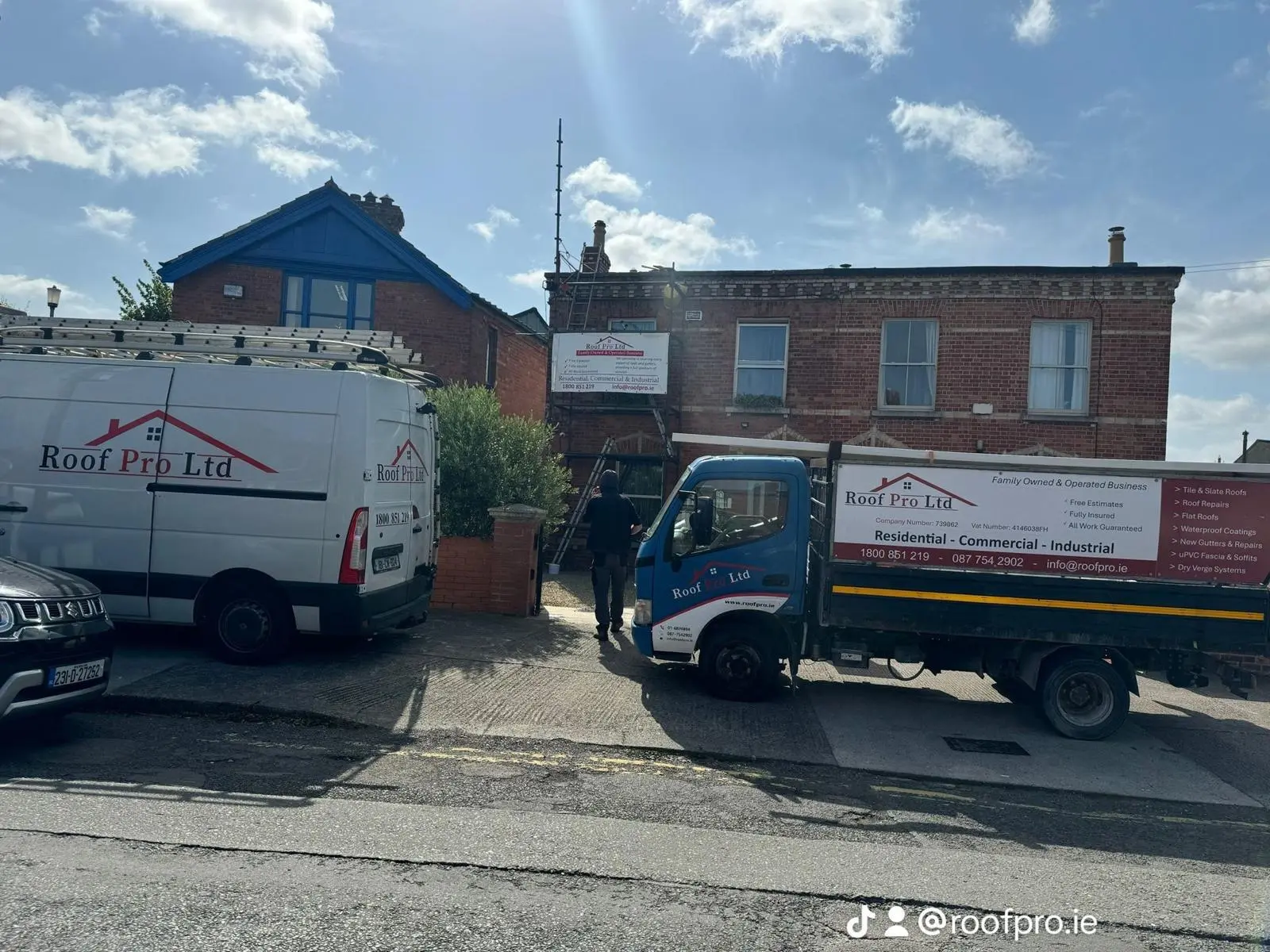 Roof Pro Ltd vans and branded truck outside a Dublin property