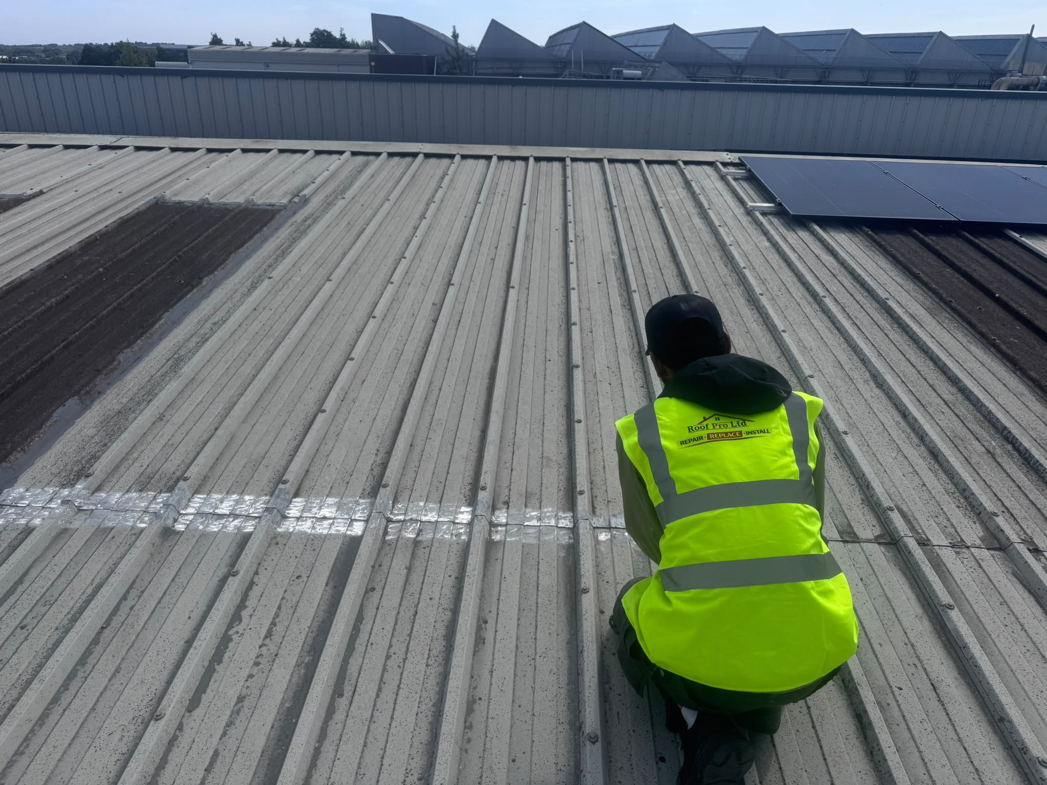 Roof Pro Ltd inspecting a commercial metal roof in Dublin