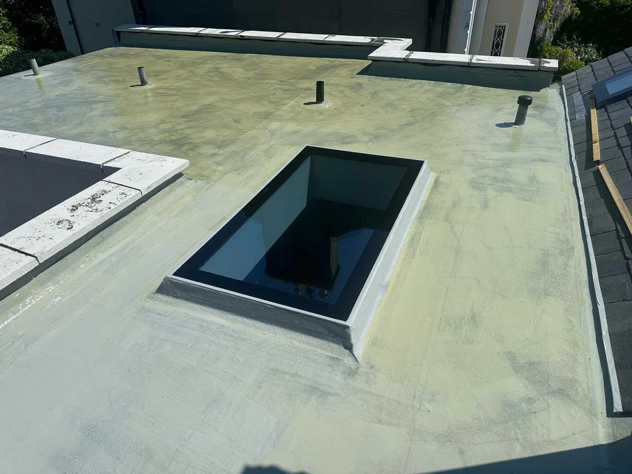 Fibreglass roof restoration base coat in Dublin by Roof Pro Ltd