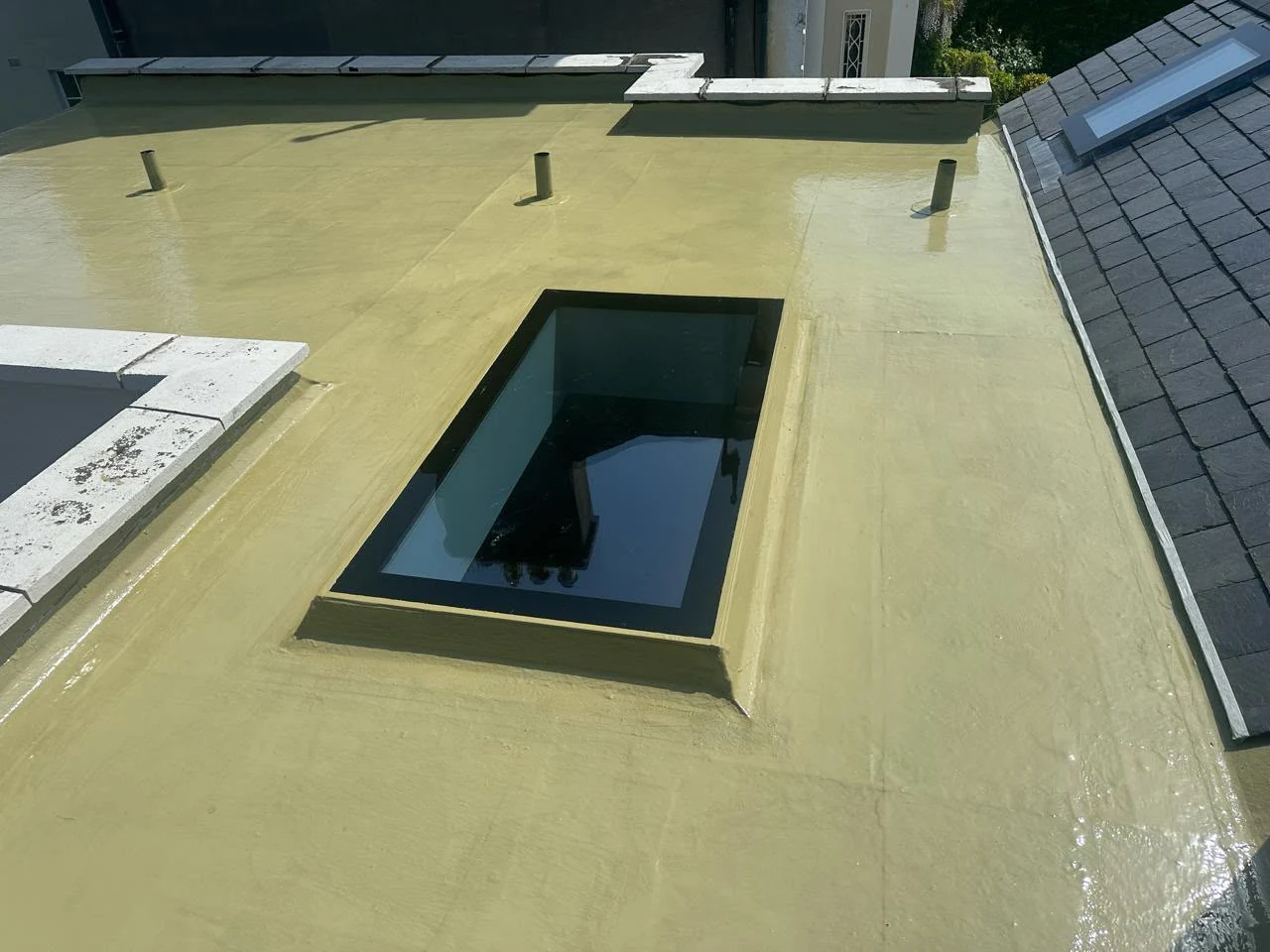 Fibreglass roof restoration second coat in Dublin by Roof Pro Ltd